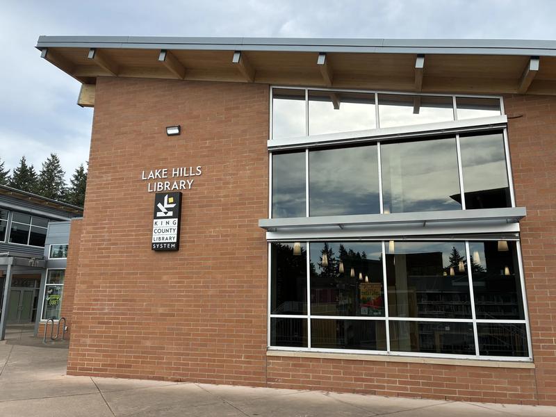 Lake Hills Library in Bellevue, a low brick building with a glass entry and a landscaped front.