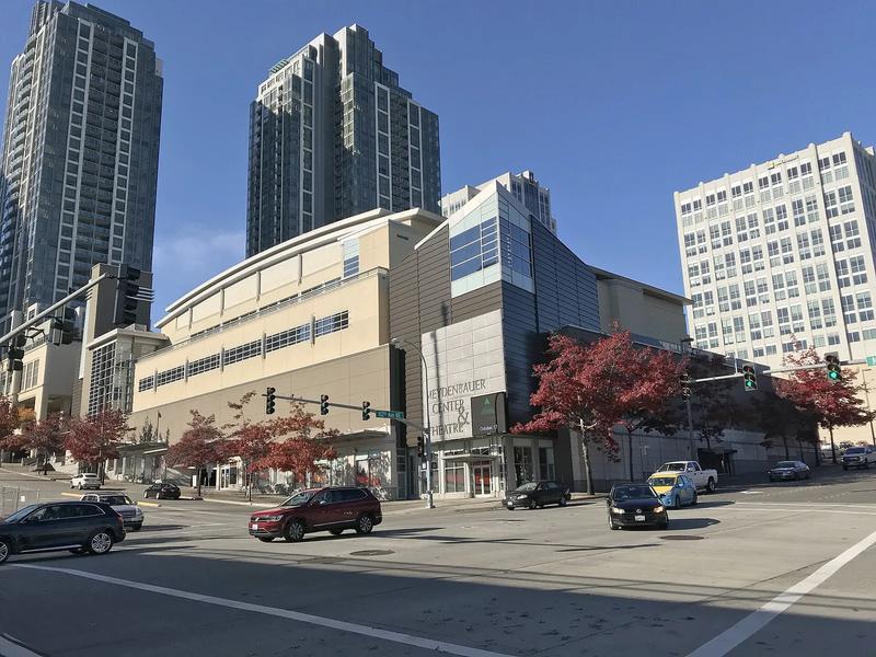 Meydenbauer Center in downtown Bellevue, a curved glass building beside the street.