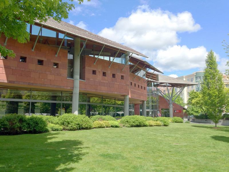 Glass front of Bellevue Library, with the King County Library System sign by the doors.