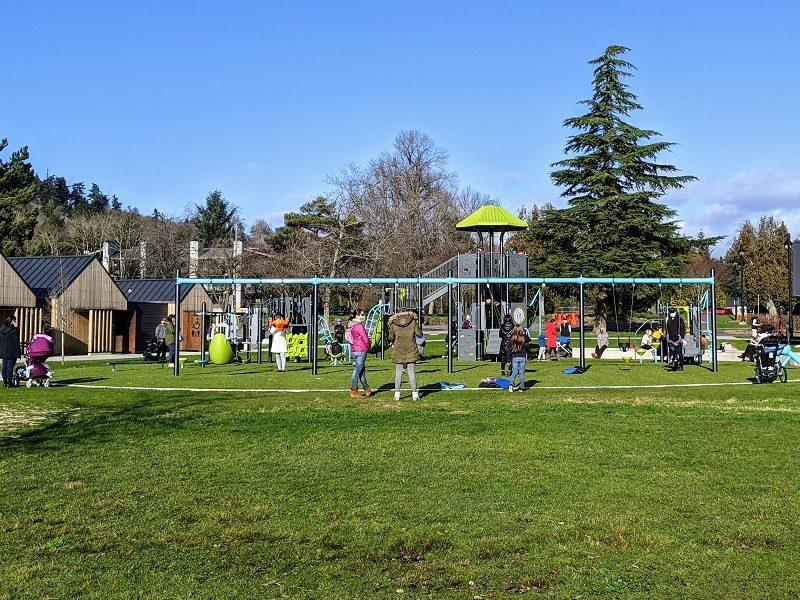 Play structure and swings at Juanita Beach Park in Kirkland, with the lake in the background.