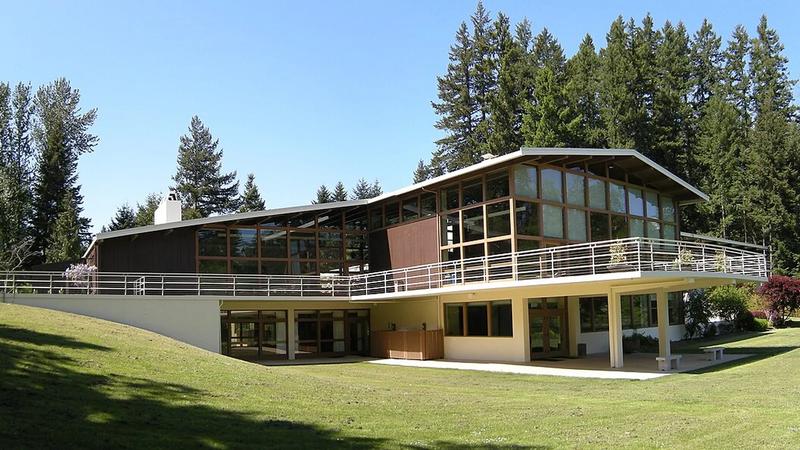 Lake Wilderness Lodge in Maple Valley, a low wood and stone building beside the lake.