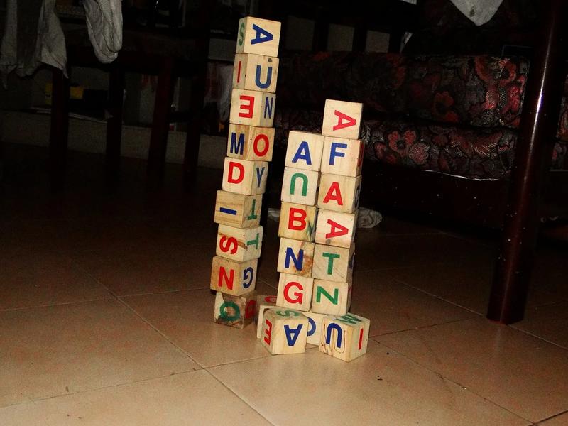 A pile of wooden alphabet blocks.
