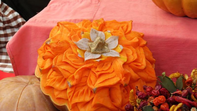 A pumpkin carved into a flower shape.