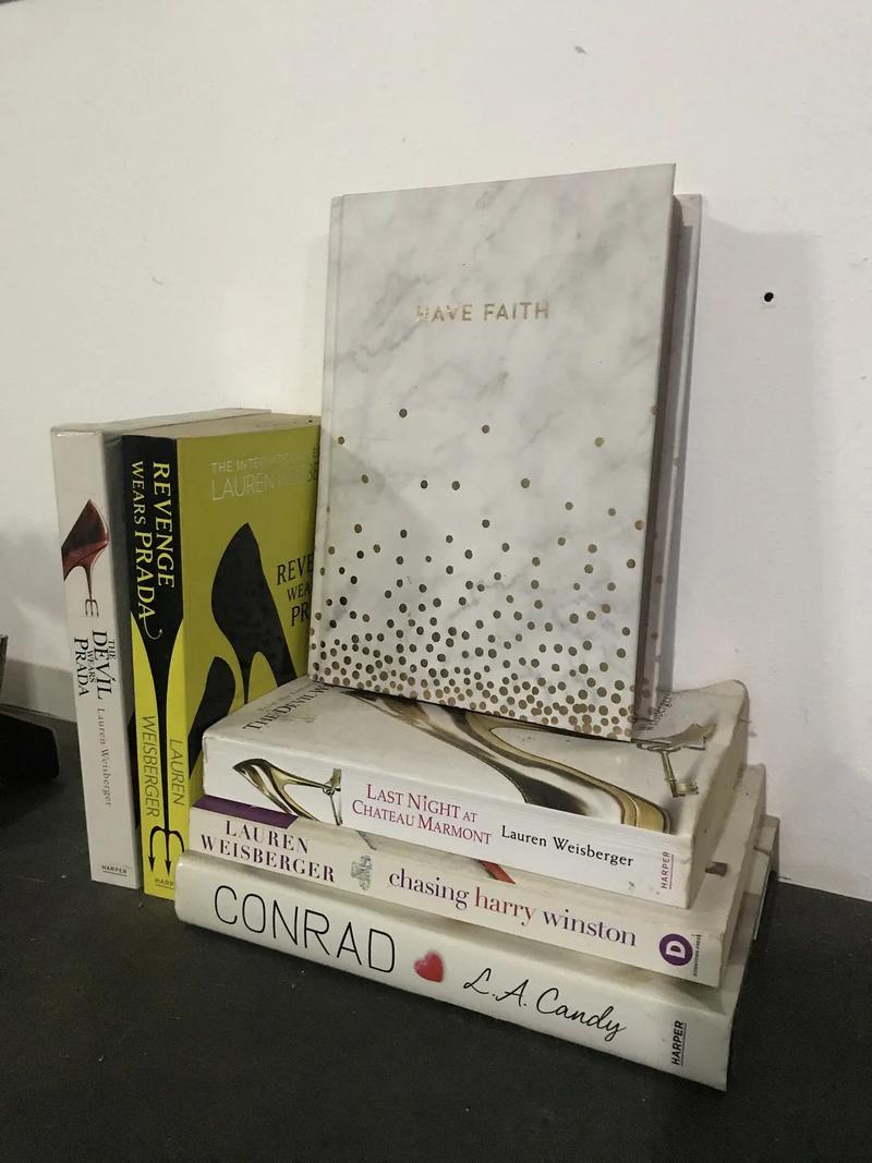 A stack of hardcover books tied with twine.